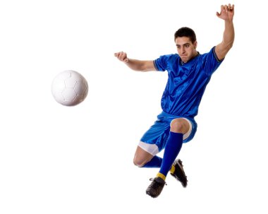 Soccer player kicking. Studio shot over white. clipart