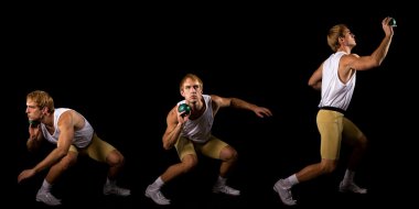 Athlete competing in shot put. Studio shot over black. clipart