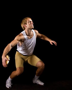 Athlete with discus. Studio shot over black. clipart