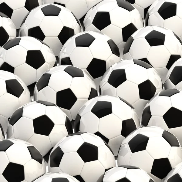 Pilha de bolas de futebol como fundo — Fotografia de Stock
