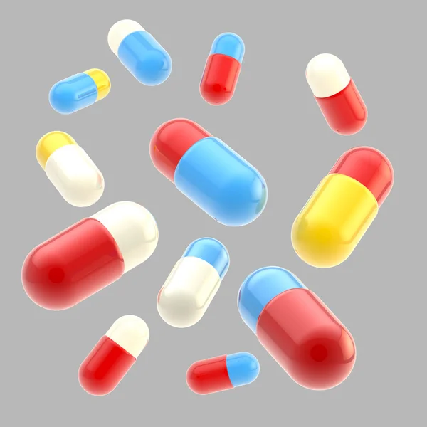 Caduta pillole mediche isolate — Foto Stock