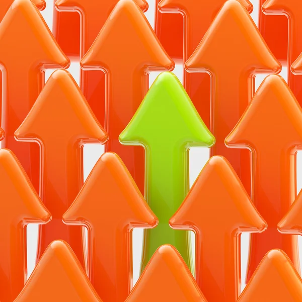 Green arrow among the orange ones — Stock Photo, Image