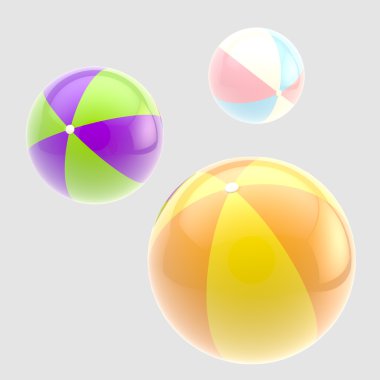 Üç parlak renkli şişme top izole