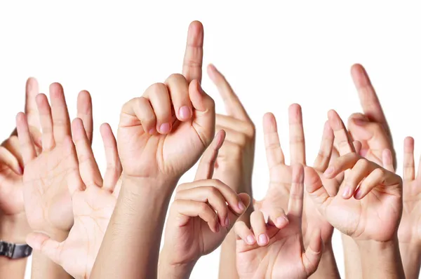 Hands raised together — Stock Photo, Image
