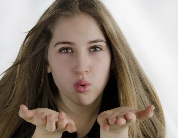 Young woman blowing a kiss — Stock Photo, Image
