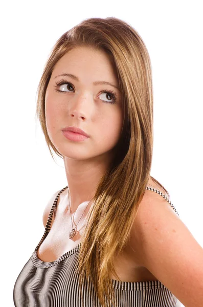 Portrét krásné dospívající dívka s vážným výrazem na bílém — Stock fotografie