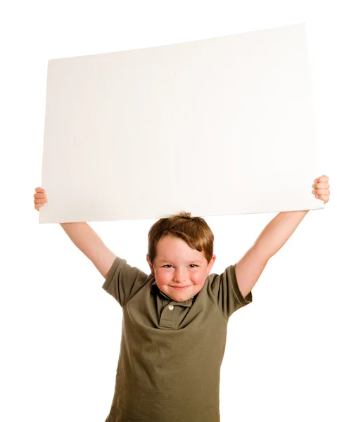 Portret chłopca dziecko trzyma znak puste miejsca na swoją kopię na białym tle — Zdjęcie stockowe