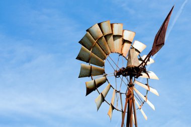 Old rusty windmill at rural farm clipart