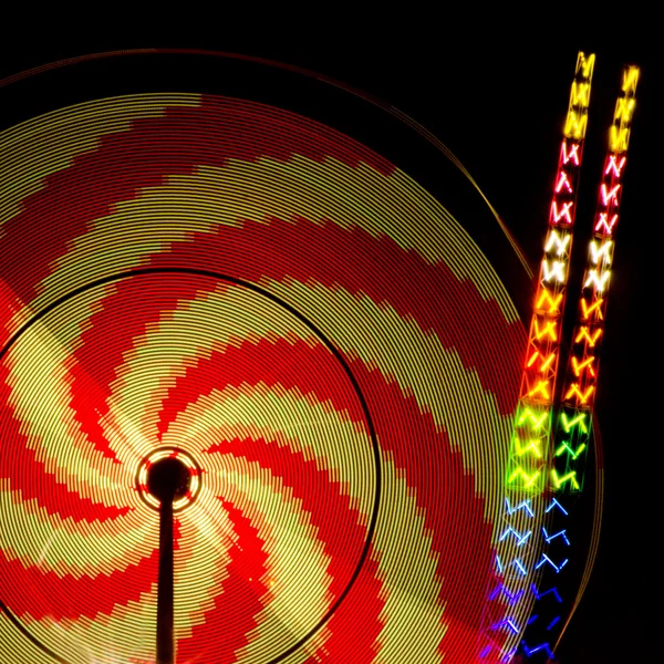 stock image Spinning amusement park rides at Panama City Beach, Florida, with motion blur