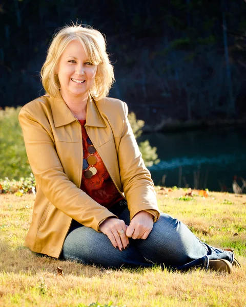 Fall portrait of happy middle-aged blonde woman — Stock Photo, Image