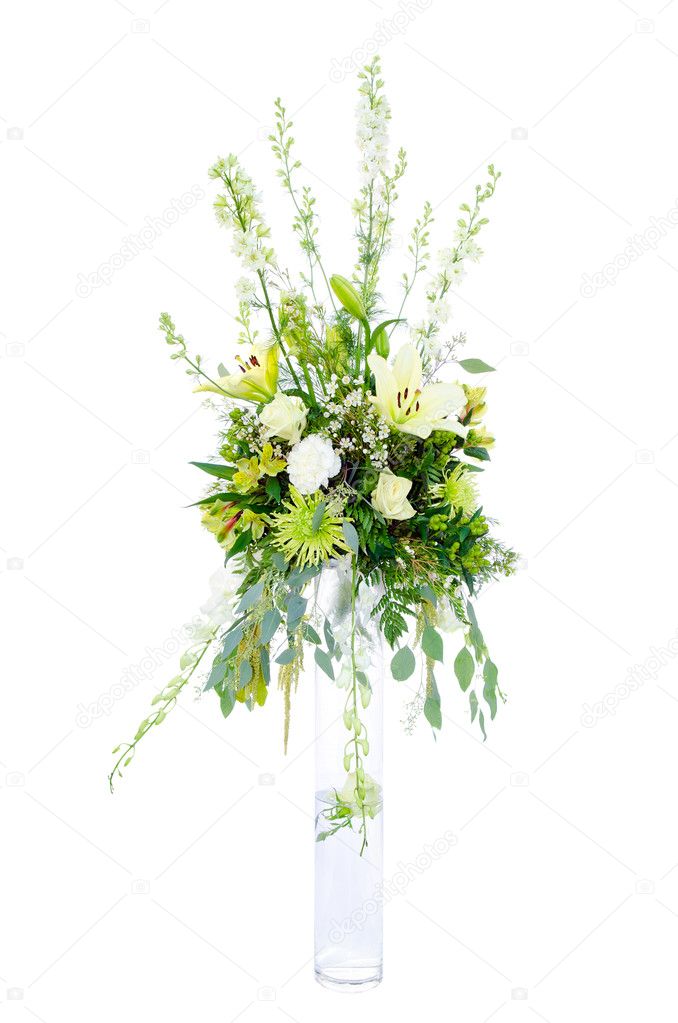 Large wedding flower arrangement with roses, lilly, mum, spider chrysanthemum and carnation isolated on white