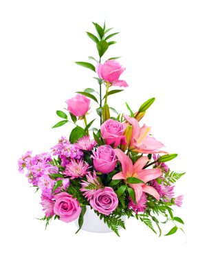Colorful purple flower arrangement centerpiece with roses, lily, carnations, isolated on white.