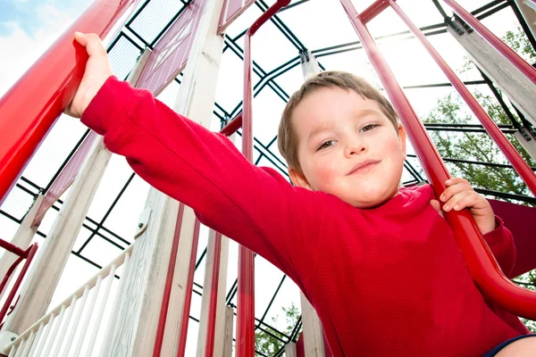Young boy on playground during spring. — Stock Photo, Image