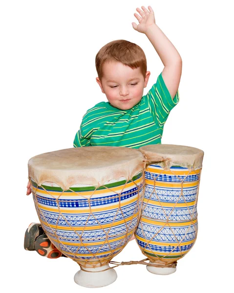 Young boy plays African bongo tom-tom drums, isolated on white background — Stock Photo, Image