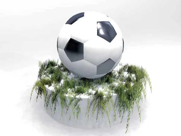 Der Fußball auf einem Sockel aus Gras — Stockfoto