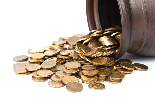 鍋から出て下落の黄金のコイン — ストック写真