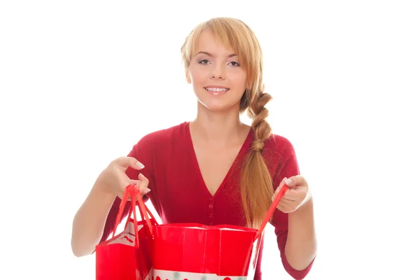 Beautiful young woman with a shopping package — Stock Photo, Image