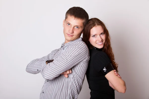 Young couple with folded hands — Stock Photo, Image
