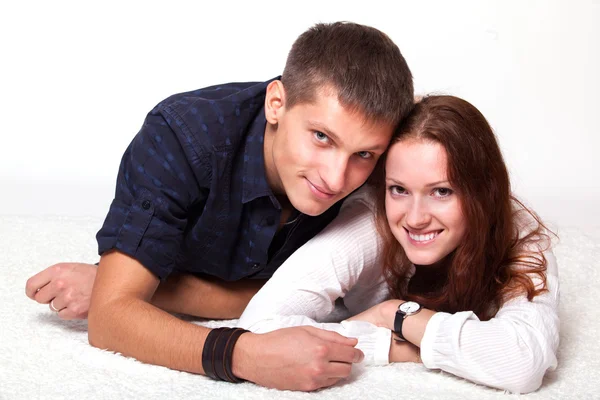 Young man embraces woman — Stock Photo, Image