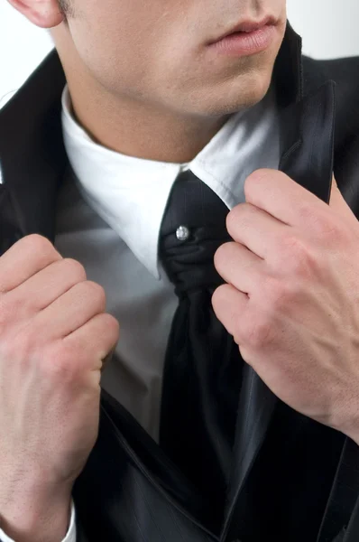 Young handsome businessman in black suit on white. — Stock Photo, Image