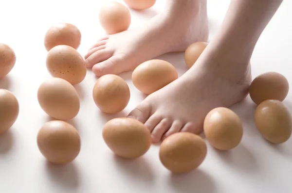 stock image Eggs with children's feet