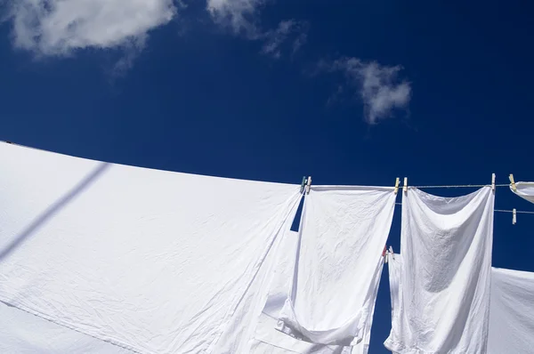 Fresh washed white towels drying on the wind — Stock Photo, Image