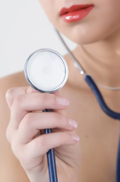 stock image Successful female doctor holding something