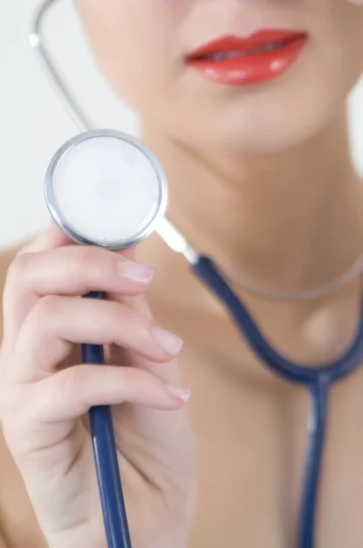 stock image Successful female doctor holding something