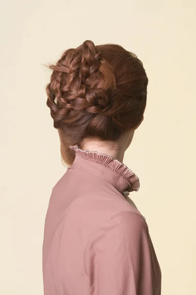 Rear view of a beautiful coiffure from pigtails — Stock Photo, Image