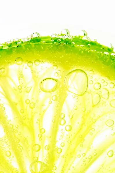 stock image Lime with bubbles on white