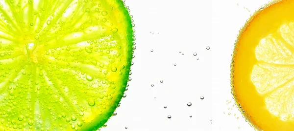 Lime with bubbles on white — Stock Photo, Image