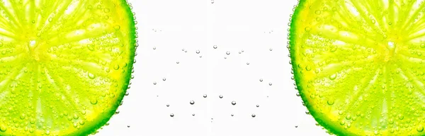 Kalk med bubblor på vit Royaltyfria Stockfoton