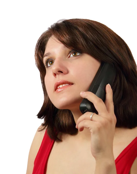 stock image Attractive brunette talking on cell phone and looking up isolated on white background