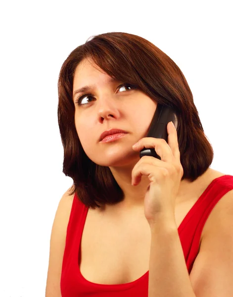 stock image Attractive brunette talking on cell phone and thinking isolated on white background