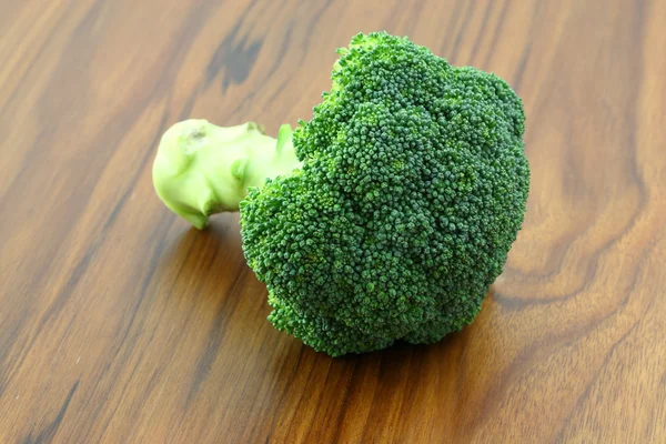 Broccoli in wood background — Stock Photo, Image
