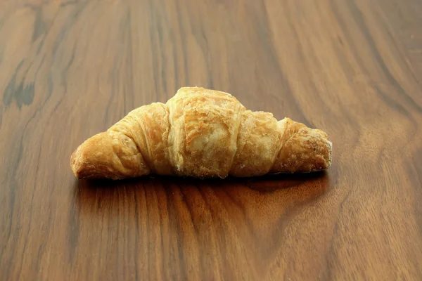 Croissant v pozadí — Stock fotografie