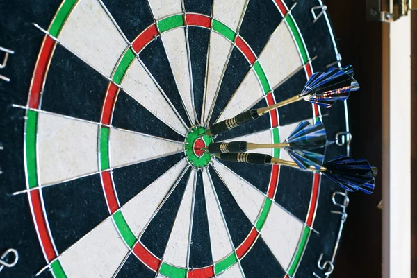 stock image Three darts in the center of the target