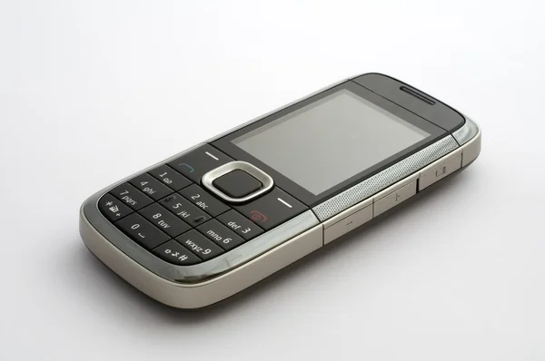 Mobiele telefoon op het platte oppervlak close-up — Stockfoto