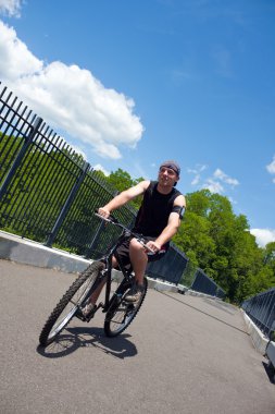 Man Riding a Bike clipart