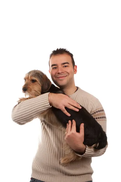 Mężczyzna trzyma psa borkie — Zdjęcie stockowe