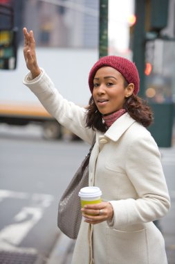 Woman Hailing A Cab clipart