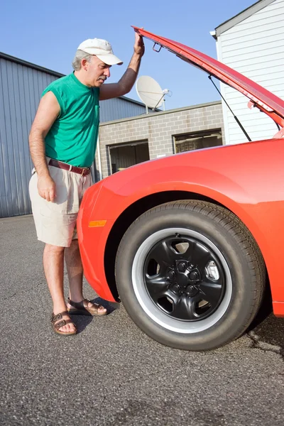 Checking Under the Hood — Stock Photo, Image