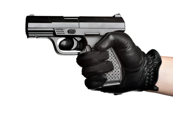 Hand pekar en svart pistol — Stockfoto