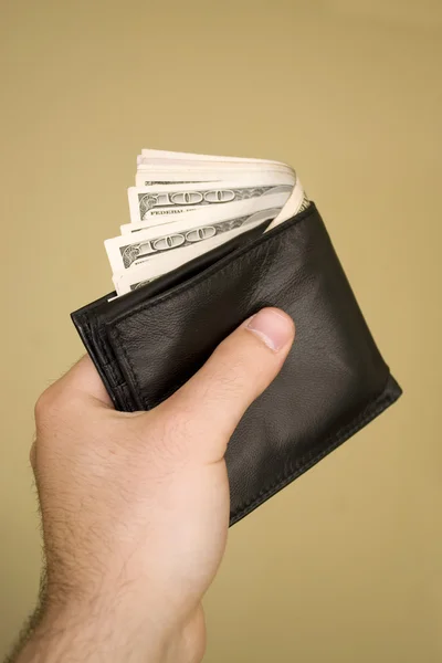 Бумажник полный денег — стоковое фото