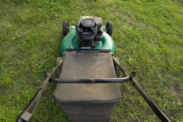Pushing a Lawn Mower — Stock Photo, Image