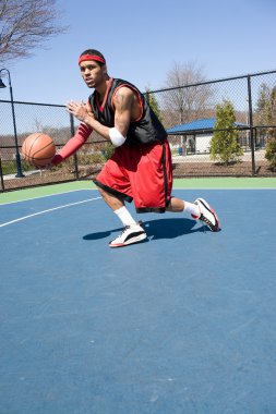 Basketball Player Dribbling clipart