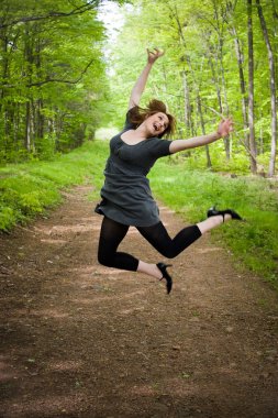 Joyful Jumping Woman clipart