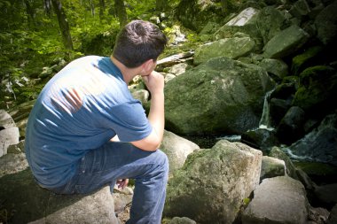 Thinking by the Waterfall clipart