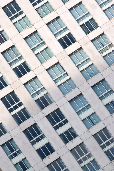 Closeup of the rows of windows on a city building.