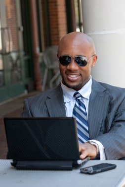 Business Man Working Wirelessly and Mobile clipart